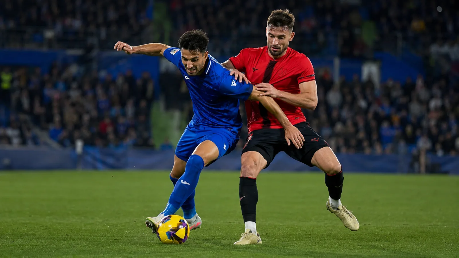 Getafe RCD Mallorca : duel intense au milieu de terrain entre Getafe CF et RCD Mallorca